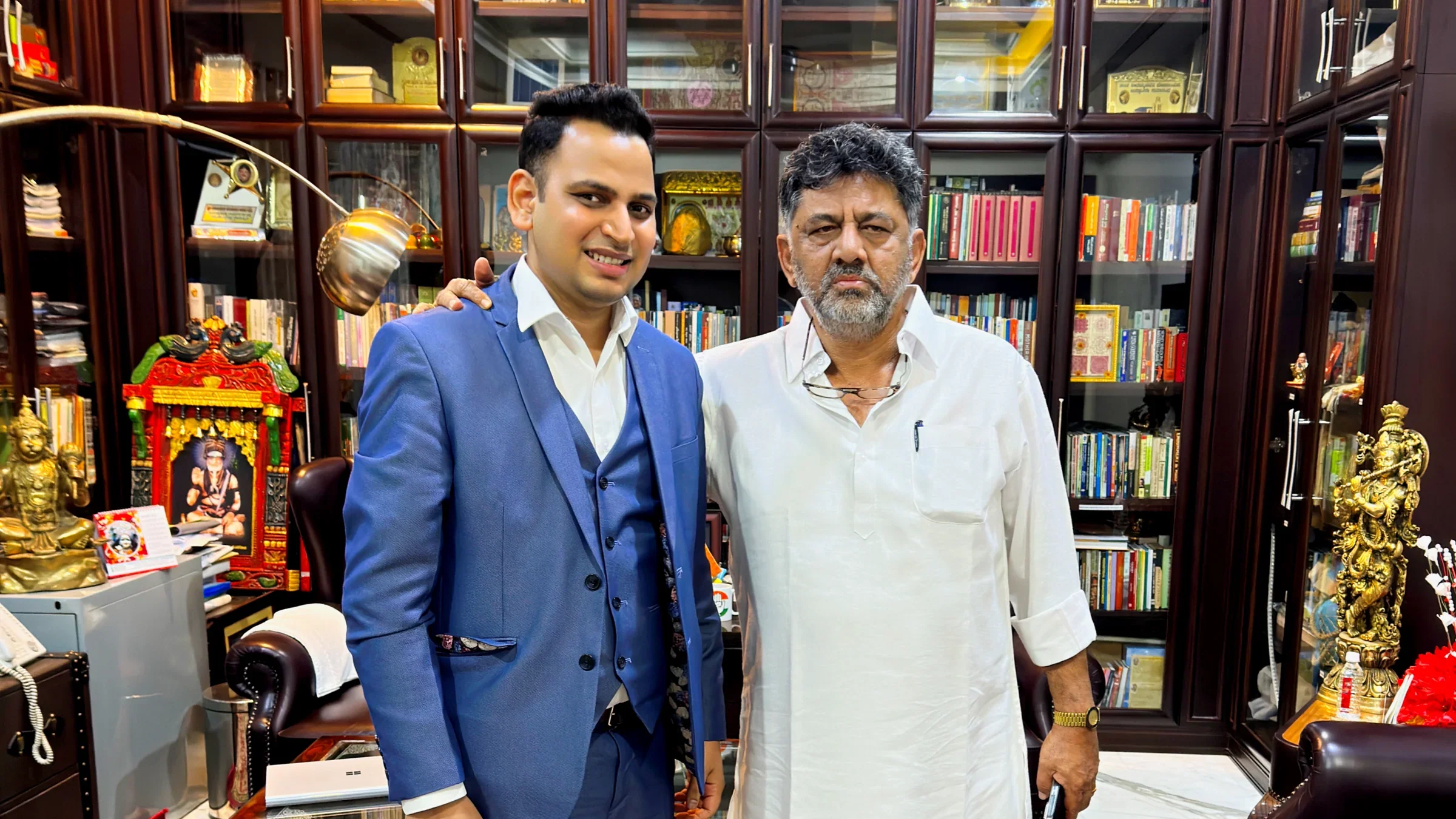 Lithvik Mukesh Sharma is photographed with D. K. Shivakumar at his home in Karnataka.