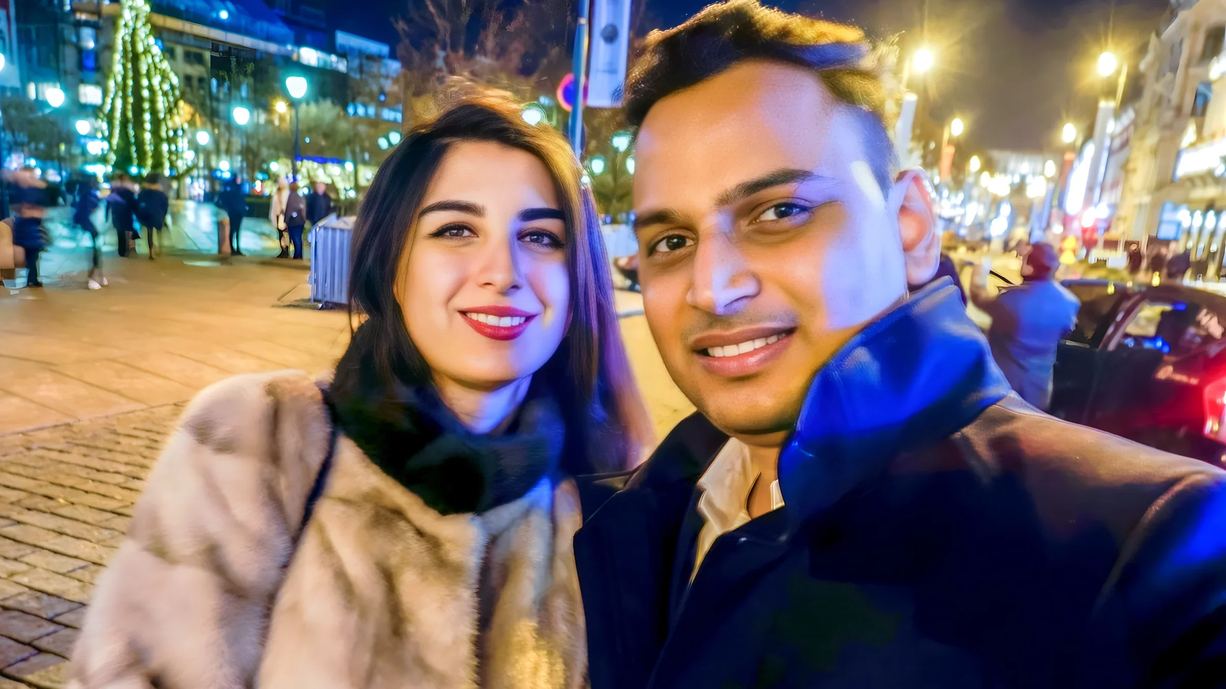 Lithvik Mukesh Sharma is photographed with an Azerbaijani princess at the Norwegian Parliament. Beside him stands a woman with long dark hair in an ornate, light-colored sari with a heavy red-and-gold border