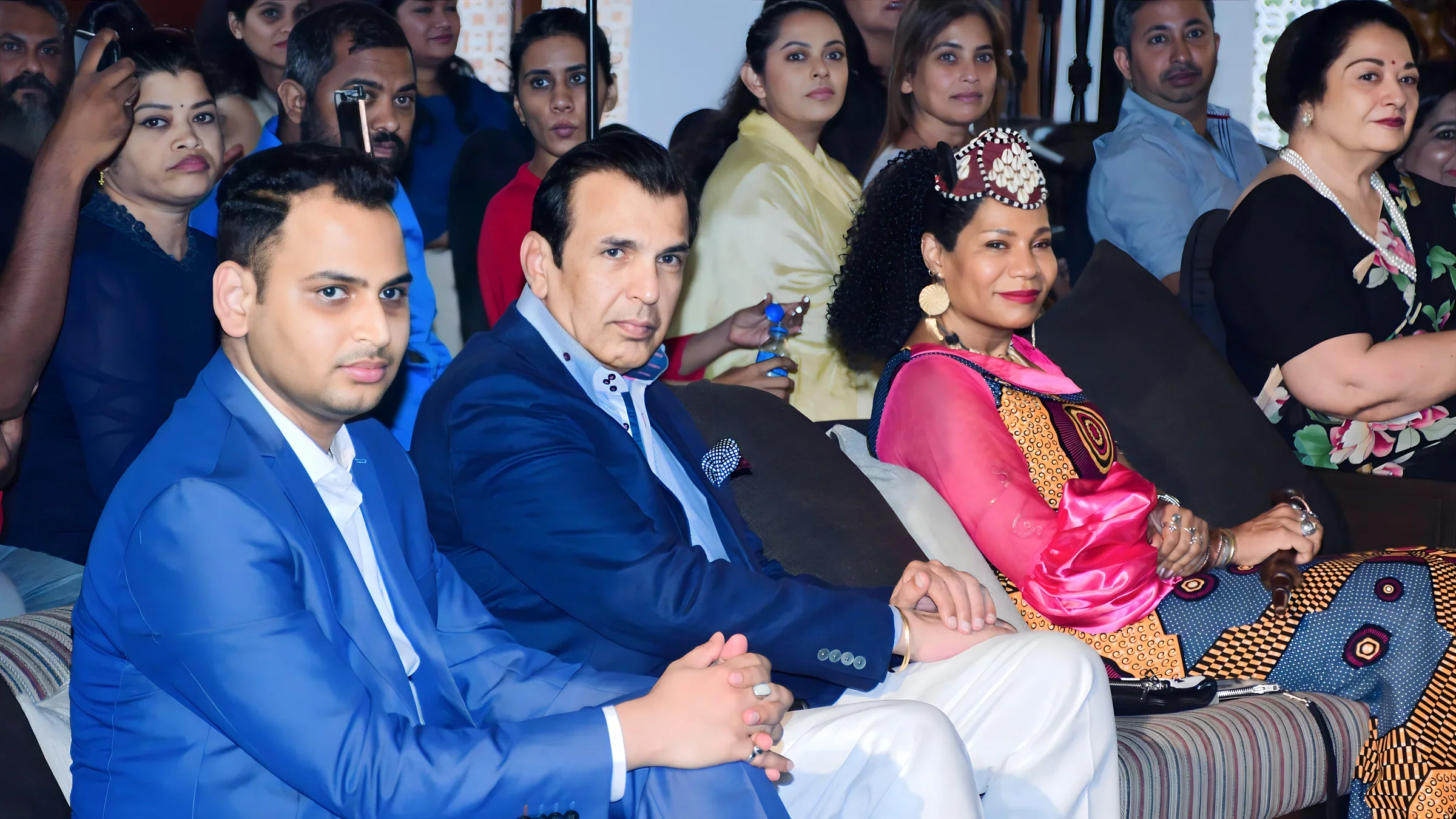 Lithvik Mukesh Sharma is photographed with Queen Diambi and Bobby Chadha.