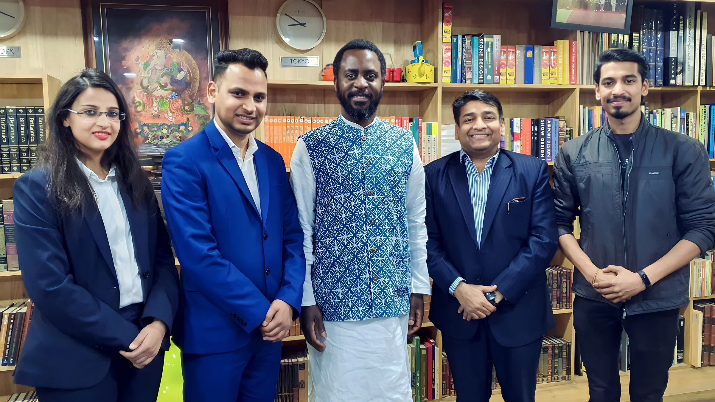 Lithvik Mukesh Sharma is photographed with Dr. Saviour Chishimba at an indoor reception